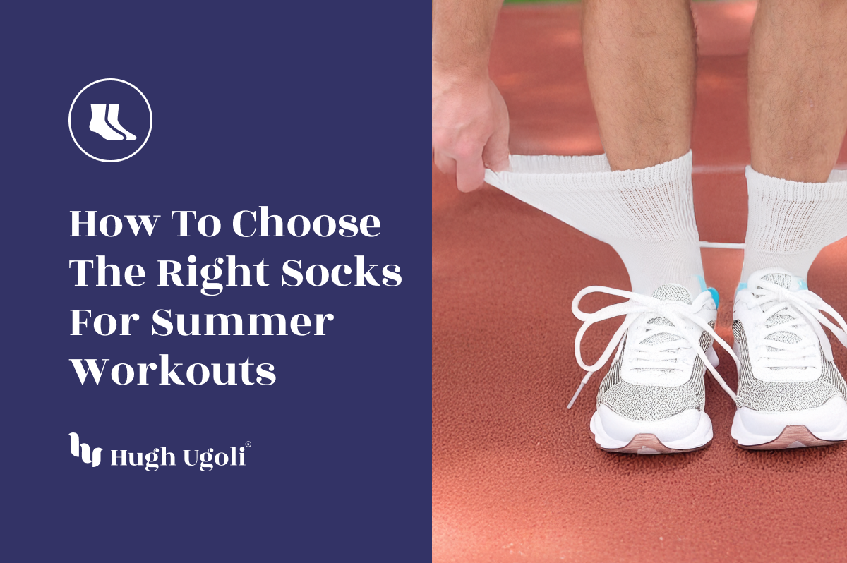 Man stretching white Hugh Ugoli athletic socks over ankles before a summer workout on a red running track.